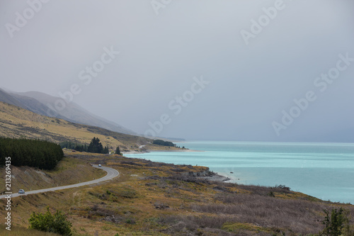 The road next to Lake Pukaki with it's beautiful turquoise waters, south island, New Zealand