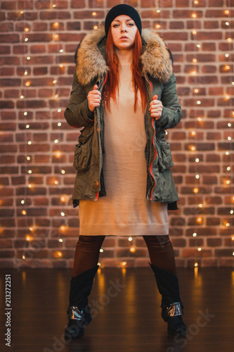 cool beautiful red-haired girl in hat