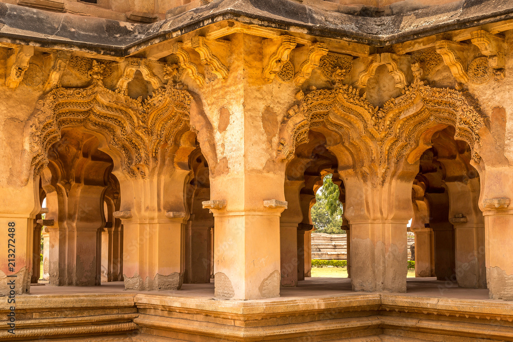 Fototapeta premium Beautiful carved stone arch. Lotus Mahal Temple in Hampi, Karnataka, India.