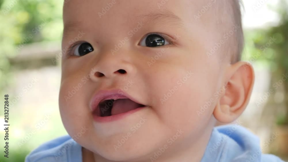 Slow motion Baby laying on bed and laughing happy time Slow motion Baby laying on bed and laughing happy time