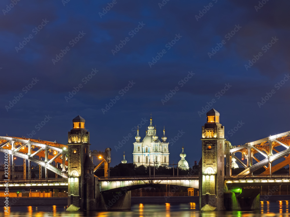 Bolsheokhtinsky bridge across Neva River in twilight. Saint-Petersburg, Russia