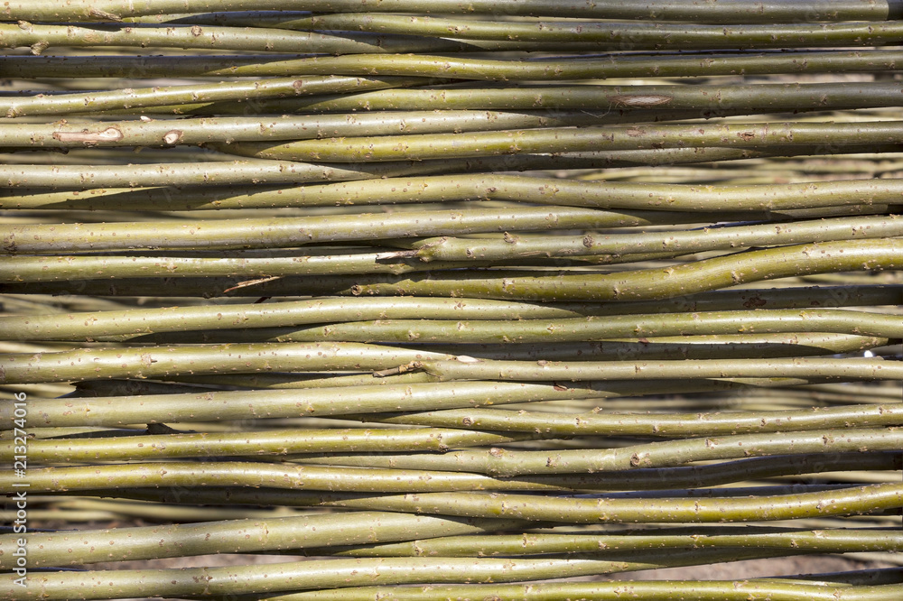 Rural old fence, made from willow tree Rural old fence, made from willow tree