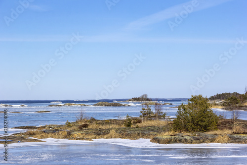 View to the lake Vanern with skerries in winter. Vanern is the largest lake in Sweden