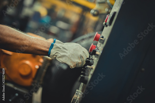 Male hand with gloves pushing button