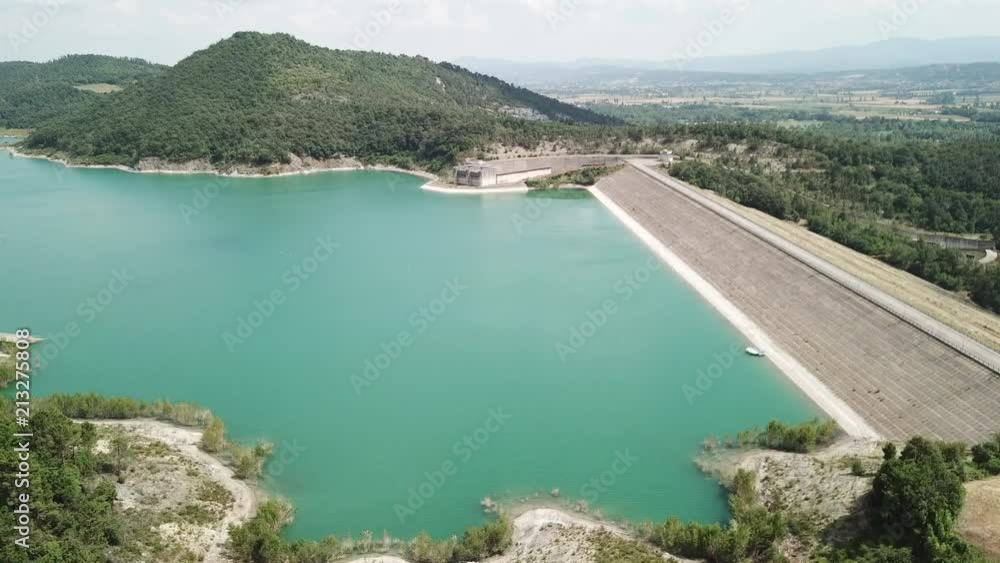 Drone aerial view of the dam of the lake Montedoglio an artificial lake, one of the biggest in Europe. Tuscany. Italy Drone aerial view of the dam of the lake Montedoglio an artificial lake, one of the biggest in Europe. Tuscany. Italy