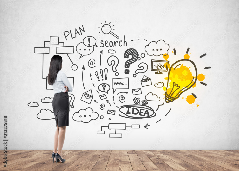 Businesswoman looking at wall, business idea Businesswoman looking at wall, business idea