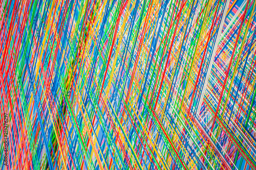Colorful strings in close up - an abstract background