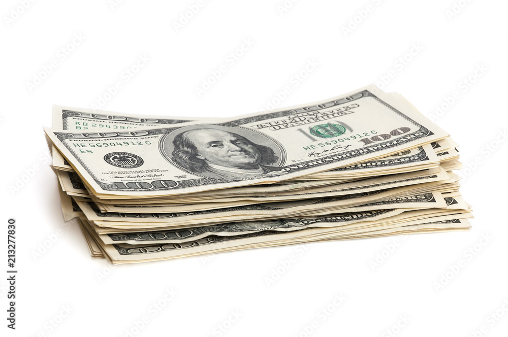 A stack of one hundred dollar bills on a white background. Isolated. A stack of one hundred dollar bills on a white background. Isolated.