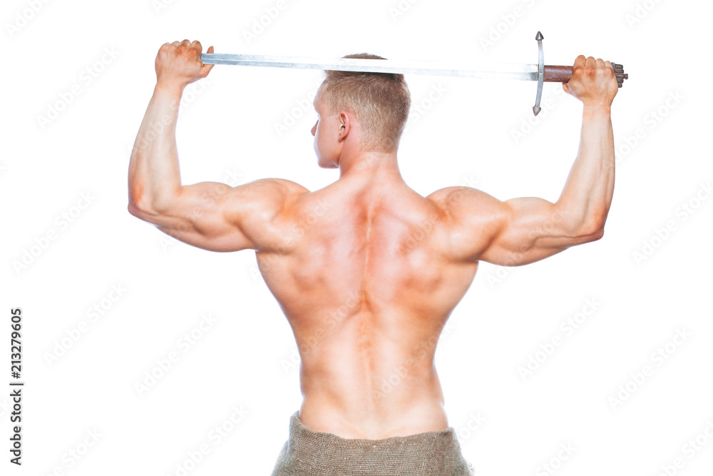 Bodybuilder man posing with a sword isolated on white background. Serious shirtless man demonstrating his mascular body. sword for head Bodybuilder man posing with a sword isolated on white background. Serious shirtless man demonstrating his mascular body. sword for head