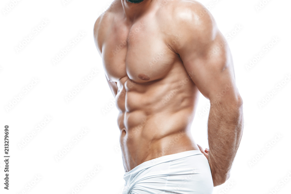Fototapeta premium bodybuilder posing. Beautiful sporty guy male power. Fitness muscled manin white lingerie. on isolated white background.