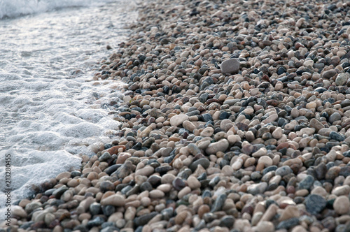 small round sea stones, pebbles on the beach