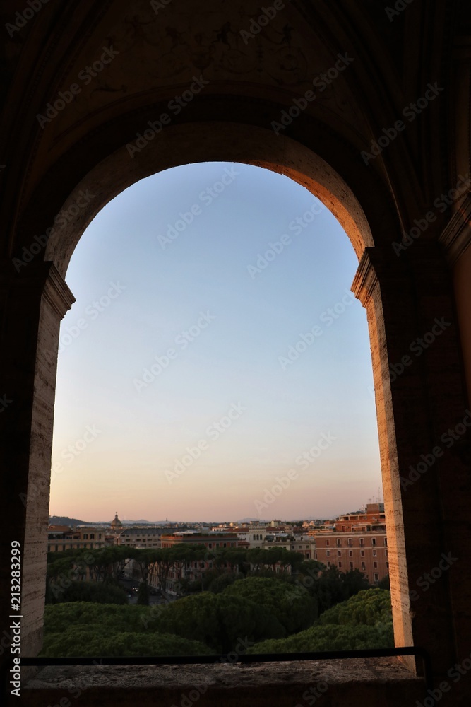 Window view to Rome at sunset, Italy 