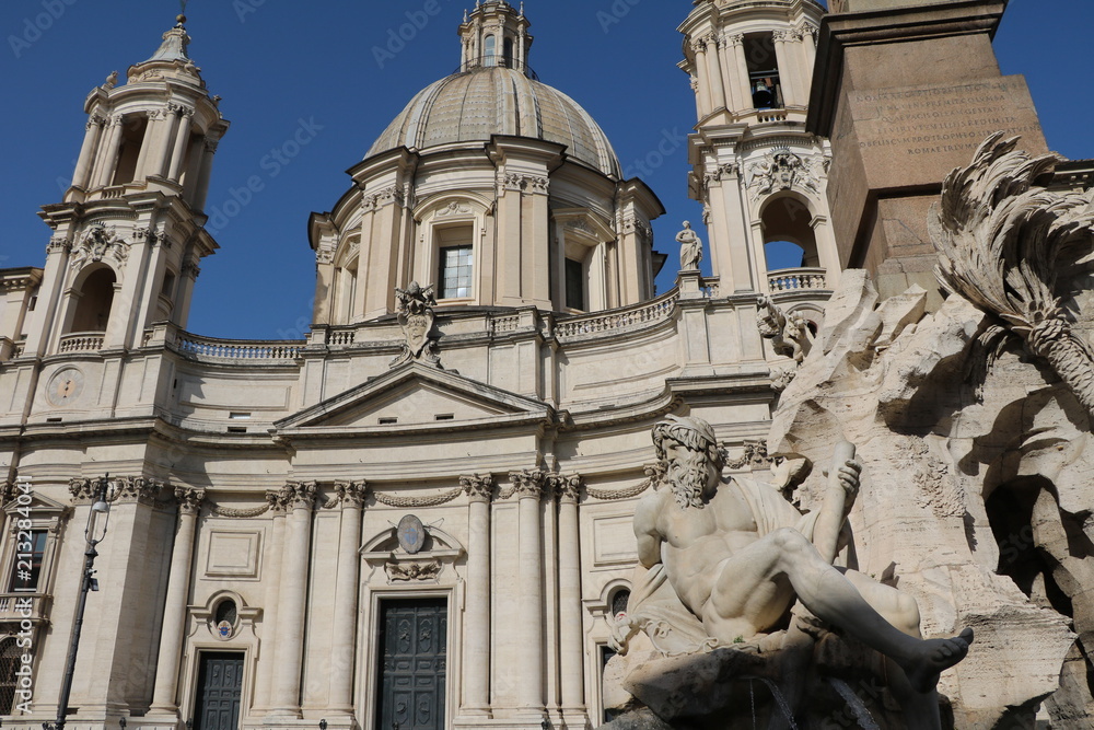 Church and Fontana dei Quattro Fiumi at Piazza Navona in Rome, Italy Church and Fontana dei Quattro Fiumi at Piazza Navona in Rome, Italy
