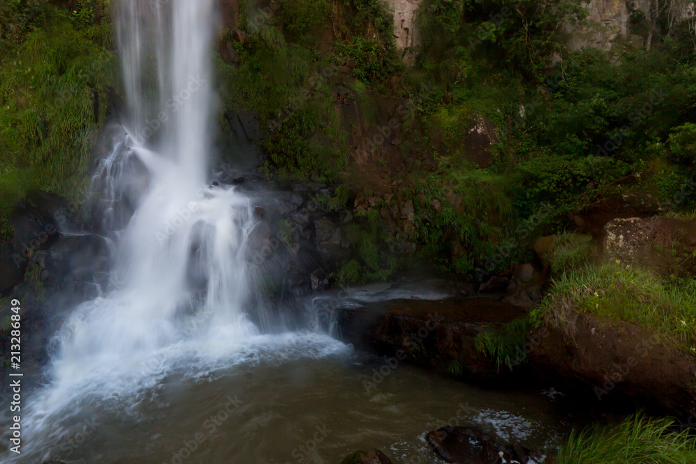 Small waterfall forming a pond Small waterfall forming a pond