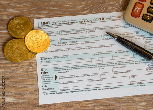 Form 1040 Simplified with bitcoin coins for reporting currency gains