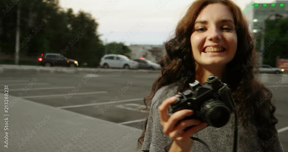 Happy Girl with retro camera in her hands Happy Girl with retro camera in her hands