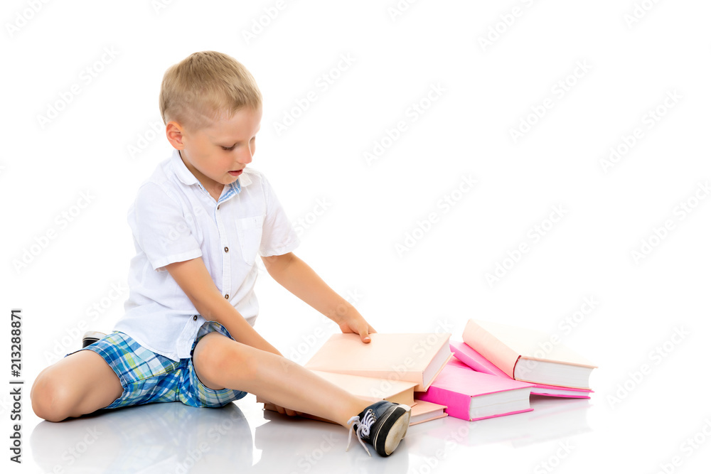 A little boy with books. A little boy with books.