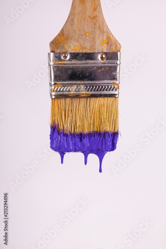 Close up purple wet paint dripping from vertical paint brush on solid white  paintbrush Stock Photo | Adobe Stock