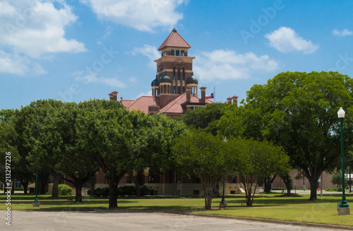 a Romanesque style courthouse in Gonzales Texas photo