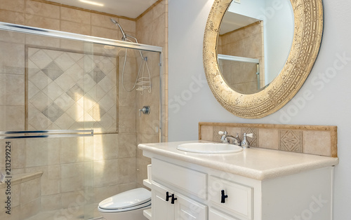 Bathroom with tub shower and glass doors