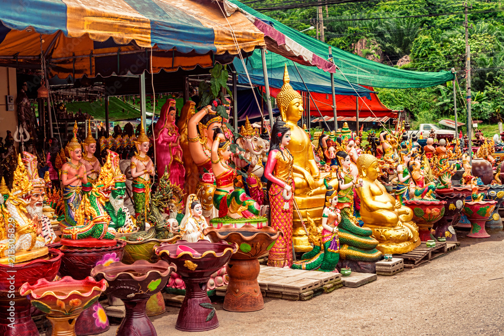 Fototapeta premium Religious artifacts on sale by the road in Lang Suan, Thailand