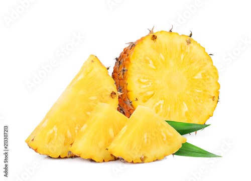 half and slices pineapple with green leaf isolated on white background