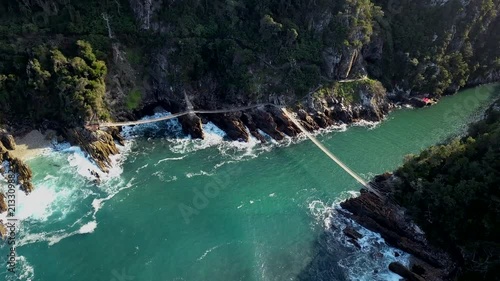 Flying over Storms River Mouth by Tsitsikama National Park in the Garden Route of south Africa. photo