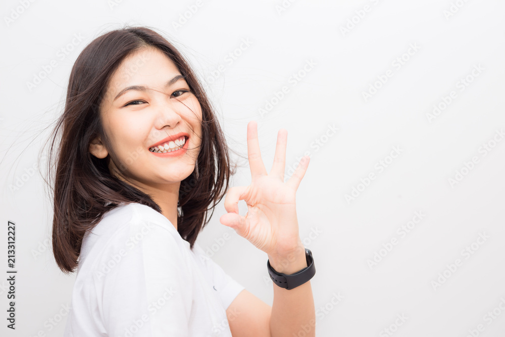 Happy cheerful women showing OK finger sign Happy cheerful women showing OK finger sign