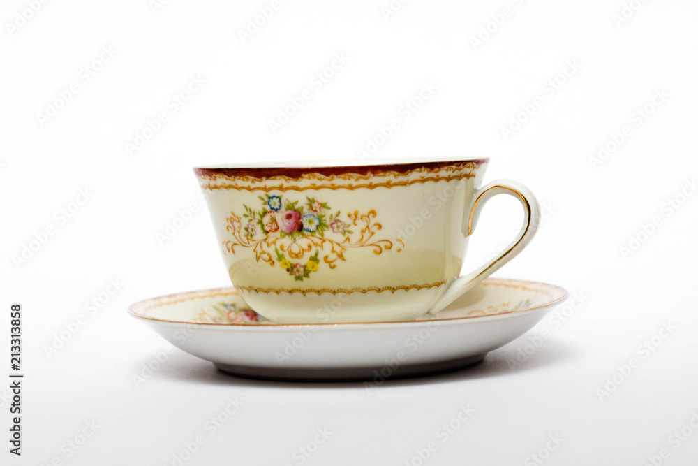 A porcelain tea cup in a saucer