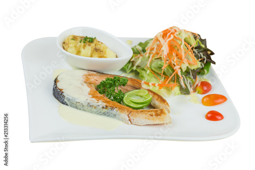 grilled salmon steak with mash potato and vegetable salad