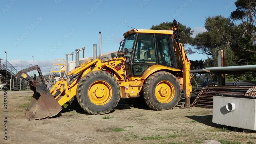 Yellow JCB Wheel Loader in the Sun Yellow JCB Wheel Loader in the Sun