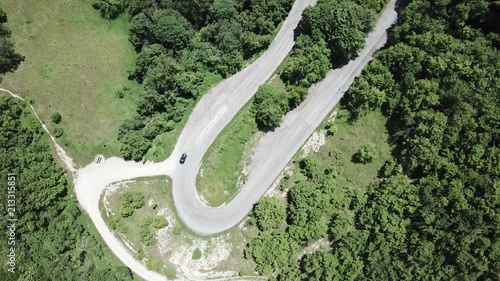 Route to Mandrioli mountain pass in Italy. Vertical view of a bend as an elbow with car photo