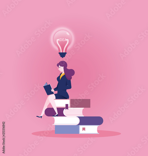 Businesswoman reading a book to find new idea - education concept