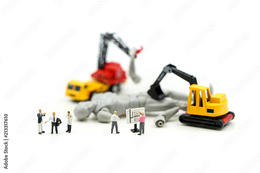 Miniature people : Businessman and Engineer deal production robots,industry Robot Business concept. Miniature people : Businessman and Engineer deal production robots,industry Robot Business concept.