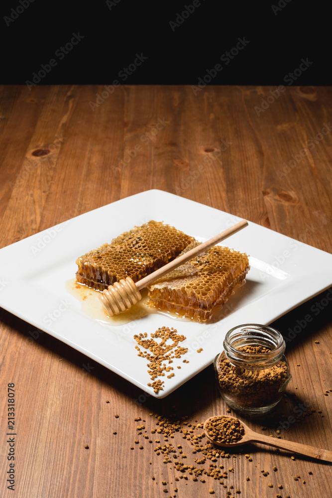 Jar of honey with honeycomb on wooden table. delicious honey honey Jar of honey with honeycomb on wooden table. delicious honey honey