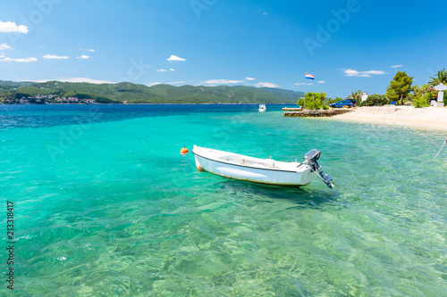 blue adriatic sea with boat on Peljesac peninsula in Dalmatia, Croatia