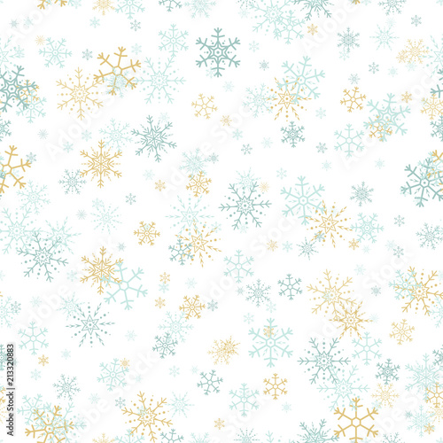 Vector seamless pattern of gold and blue snowflakes.