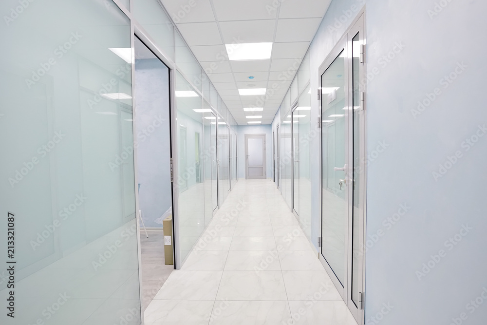 door glass plastic corridor, new office building, office rental, light blurred corridor background