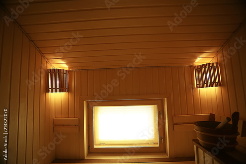 sauna, wooden interior baths, wooden benches and loungers accessories for sauna, spa complex in the hotel