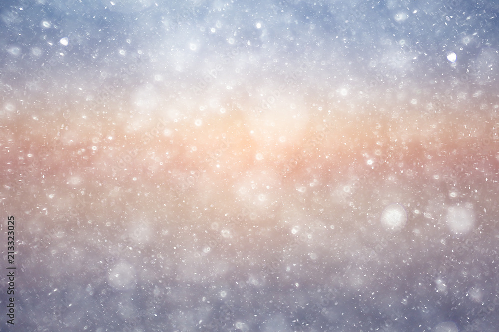 Snowfall texture of snowflakes on blurred background