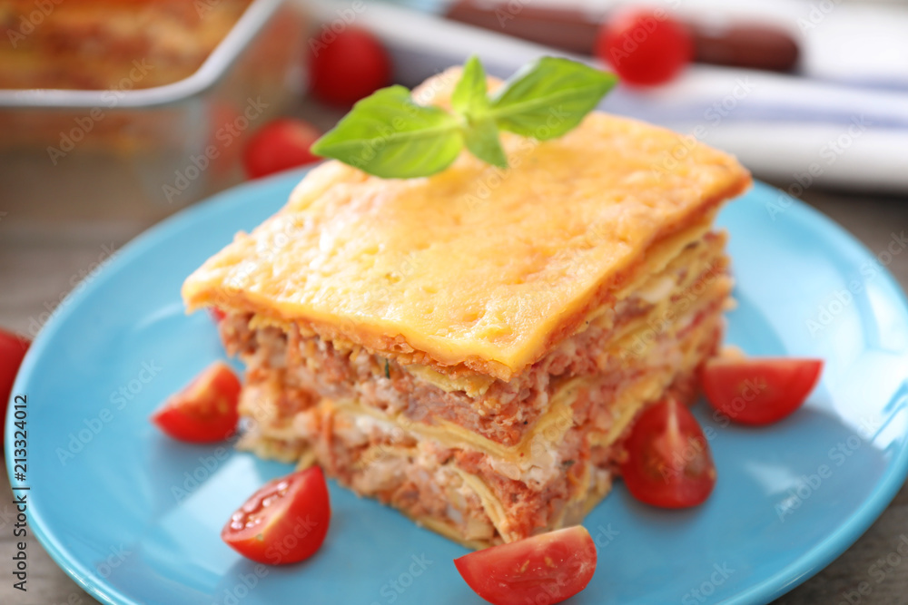 Plate with tasty lasagna on table Plate with tasty lasagna on table