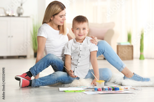 Mother with cute boy painti...