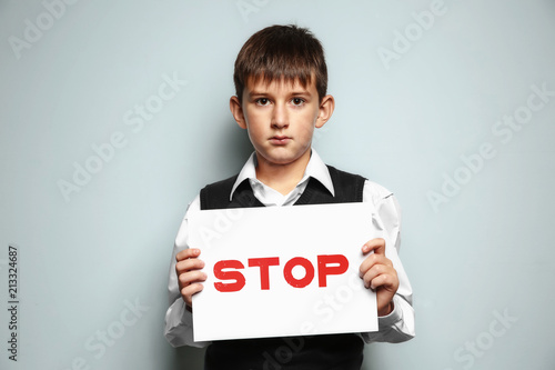 Little boy holding sign wit...