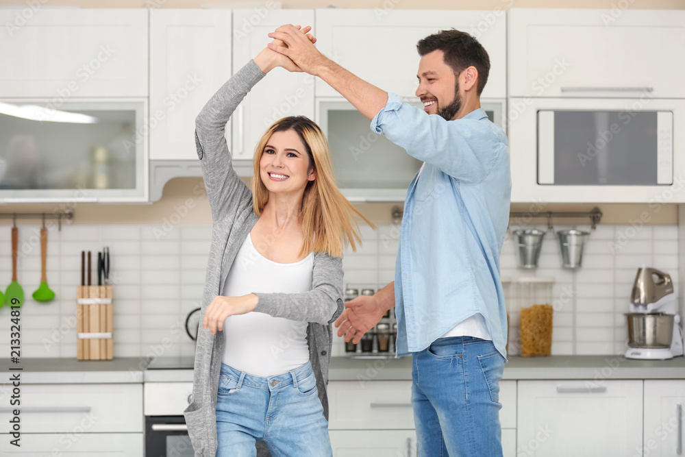 Happy couple dancing in kitchen Happy couple dancing in kitchen