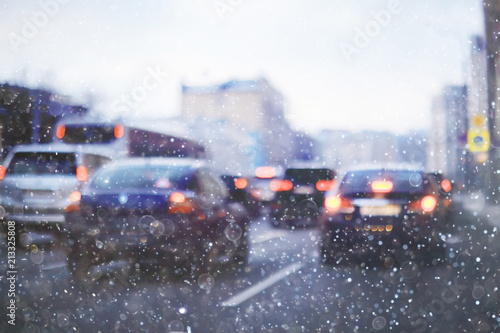 snow transport road city / landscape in a night city in winter, cars on the road in traffic jam in cold weather, snow © kichigin19