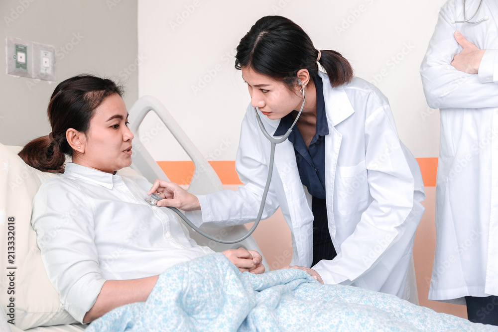 The doctor is examining the patient's health. The doctor is examining the patient's health.