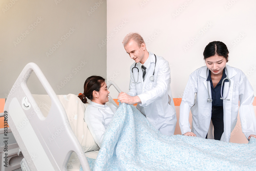 Medical team at the hospital checking paperwork and patient's medical records, healthcare and teamwork concept.