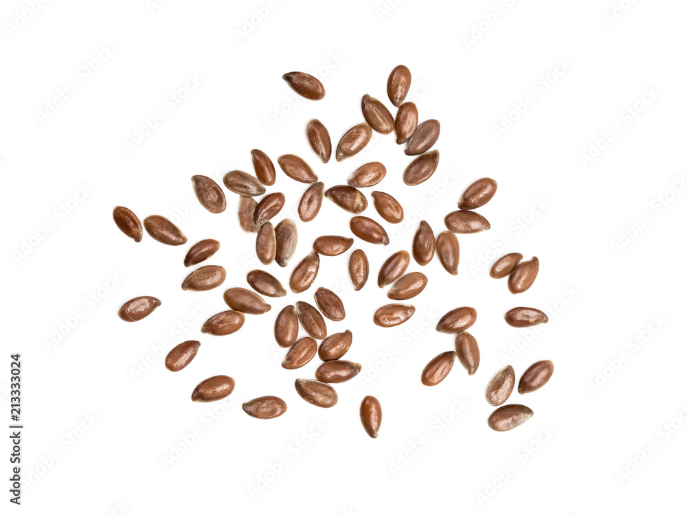 Obraz premium Some linseeds or flax seed spread out on white background seen from above