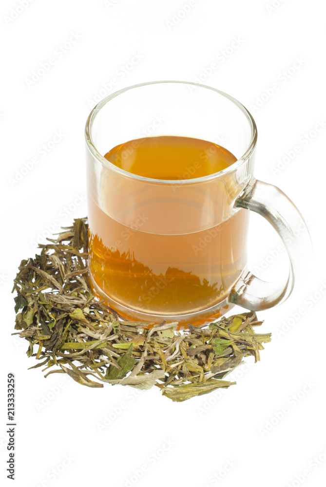 tea in glass cup and dried leaves tea in glass cup and dried leaves