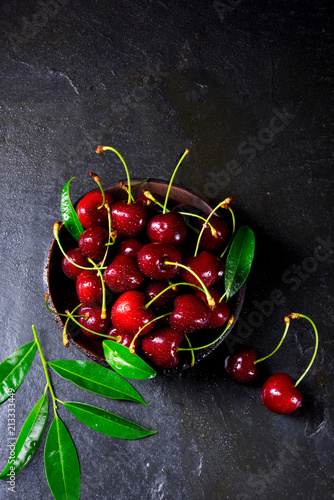 freshly picked cherry in a wooden bowl